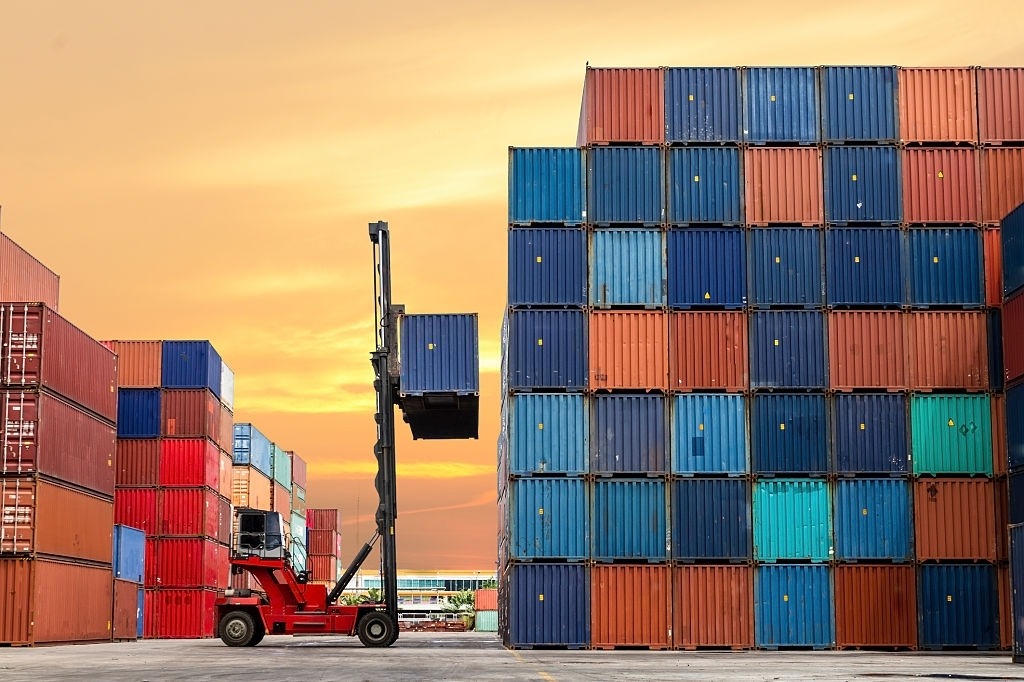 Crane Lifting Up Container in Yard, Image Courtesy of iStockPhoto