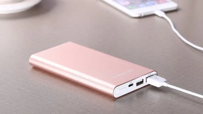 A power bank charging a mobile phone