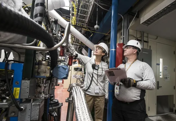 engineers looking at machinery